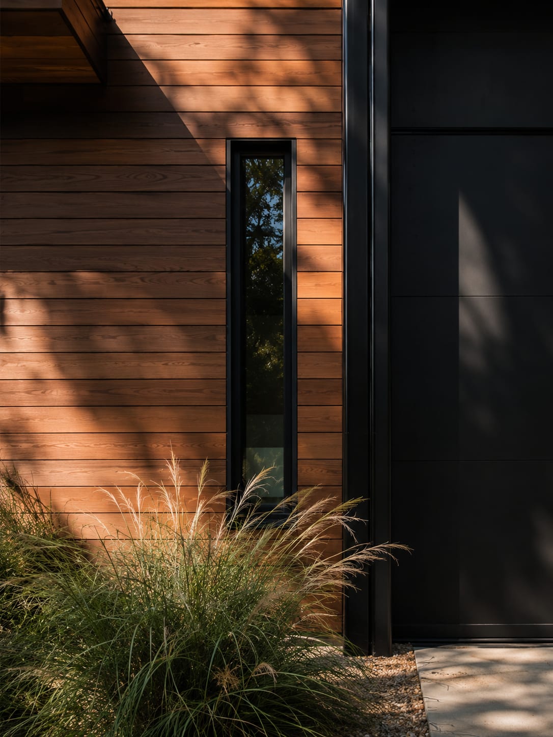 Architectural detail of a modern Austin home tucked among oaks